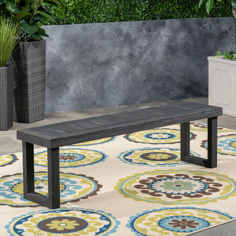 Dark gray outdoor bench with slat panel top and base by Noble House, featuring a sturdy and stylish design for outdoor seating.