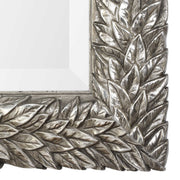 Uttermost Evelina Leaves Silver Wall Mirror with intricate leaf design, framed in polished silver for elegant wall decor.