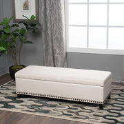Beige upholstered storage Ottoman with nailhead trim by Noble House, featuring a cushioned top and storage space inside.