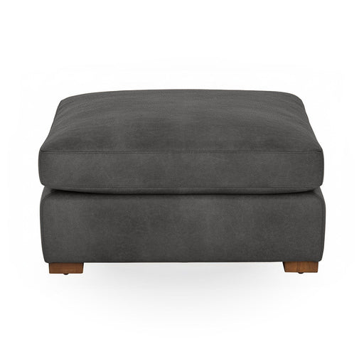 Classic Home Audrey upholstered ottoman with a cushioned, fabric-covered top and wooden legs, versatile for living room decor.