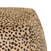 Classic Home hide accent pouf with soft fabric cover and round shape, perfect for living room or seating area.