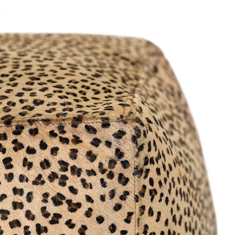 Classic Home hide accent pouf with soft fabric cover and round shape, perfect for living room or seating area.