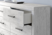 Whitewash Cayboni six-drawer dresser by Signature Design by Ashley®, featuring sleek drawers and contemporary style.
