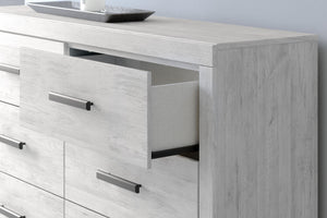 Whitewash Cayboni six-drawer dresser by Signature Design by Ashley®, featuring sleek drawers and contemporary style.