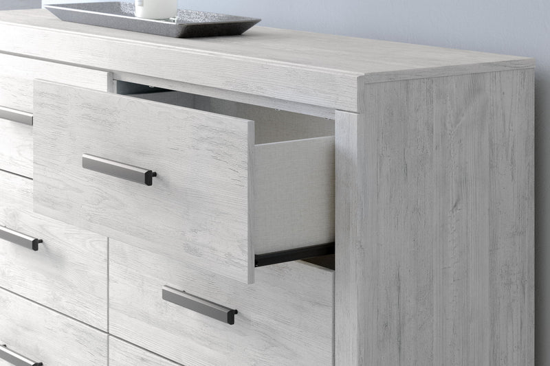 Whitewash Cayboni six-drawer dresser by Signature Design by Ashley®, featuring sleek drawers and contemporary style.
