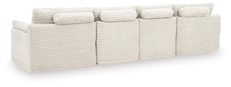 Ivory Fannin 4-piece stationary sectional with ottoman by Signature Design by Ashley, showcasing plush cushions and modern design.