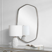 Uttermost Duronia iron wall mirror with a sleek, modern frame and reflective glass surface for stylish home decor.