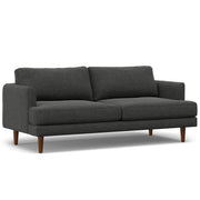 Livingston upholstered stationary sofa by Simpli-Home with plush fabric and cushioned armrests in a modern living room setting.