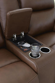 Vonryan - Power Reclining Loveseat With Console / Adj Headrest - Tobacco - R&R Furniture Gallery (Fountain Valley, CA)
