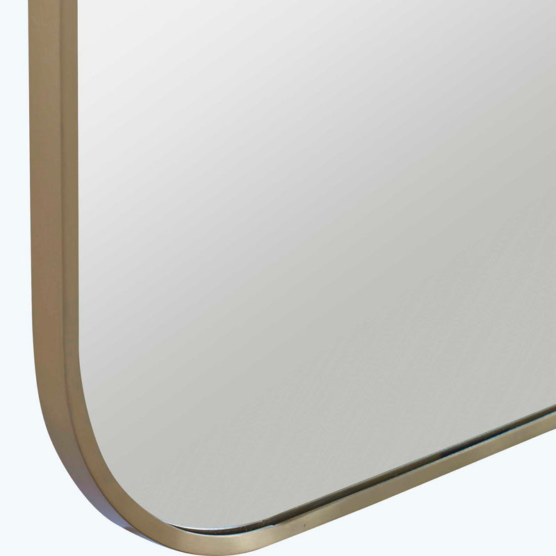 Uttermost Taft wall mirror with a sleek, modern frame hanging on a wall, showcasing contemporary home decor style.