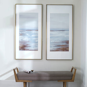 Set of two Coastline framed prints by Uttermost featuring light brown ocean-inspired artwork in sleek frames.