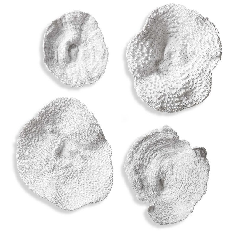Uttermost Sea Coral wall art set of 4 in white, natural coral-inspired ceramic wall decor with textured, organic designs.