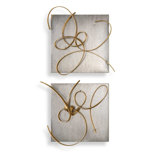 Set of two gold metal wall art pieces by Uttermost, modern wall decor with intricate geometric designs.