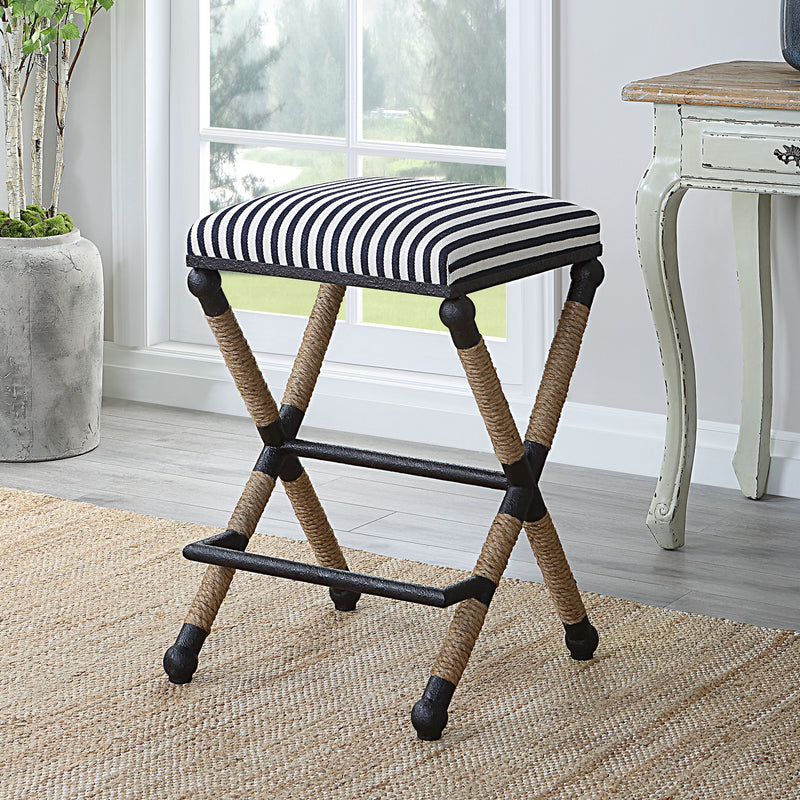 Black backless counter stool by Uttermost, 24-27 inch height, with a sleek modern design and sturdy wooden legs.