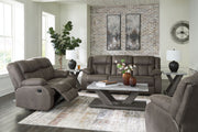 Signature Design by Ashley reclining sofa from the First Base living room set, featuring plush cushions and reclining features.