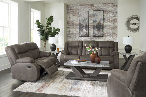 Signature Design by Ashley reclining sofa from the First Base living room set, featuring plush cushions and reclining features.