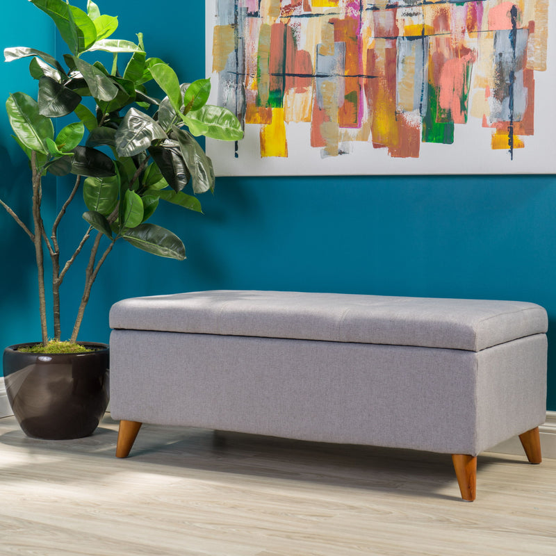 Light gray upholstered storage ottoman with lift-top and button tufted seat by Noble House, perfect for living room storage.