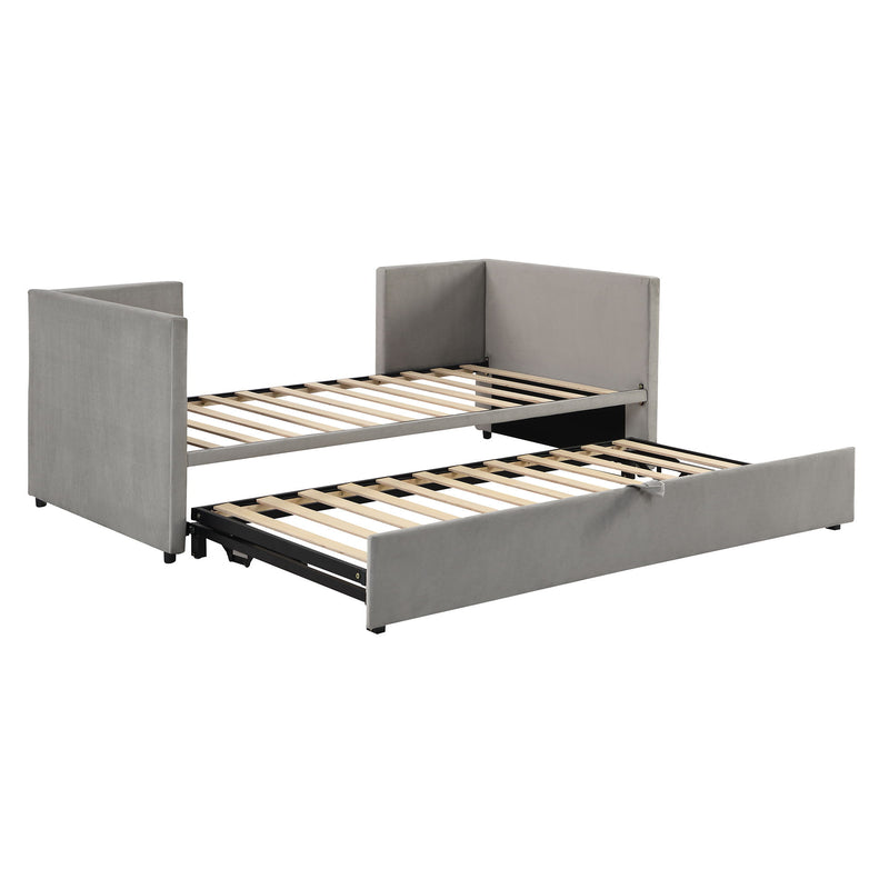 Twin size upholstered daybed with pop-up trundle from Halcyon Home, featuring plush fabric and space-saving design in a cozy bedroom setting.