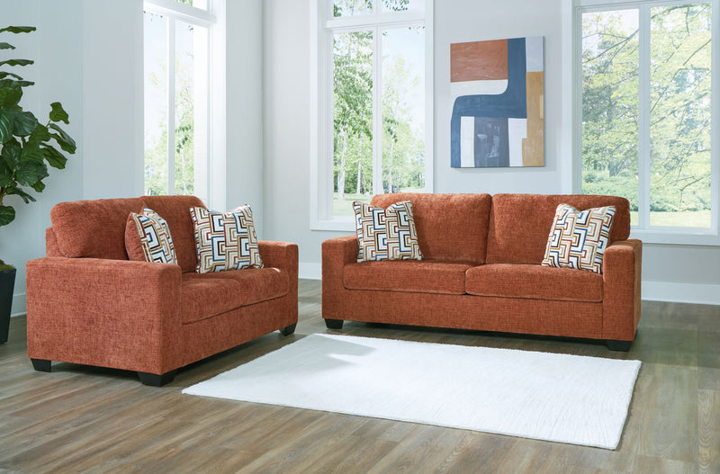 Signature Design by Ashley Aviemore living room set with stationary sofas and loveseats, featuring plush cushions and modern design.