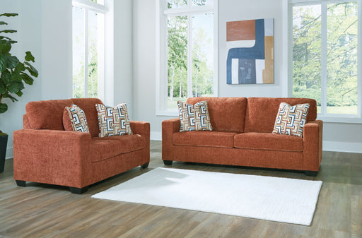 Signature Design by Ashley Aviemore living room set with stationary sofas and loveseats, featuring plush cushions and modern design.