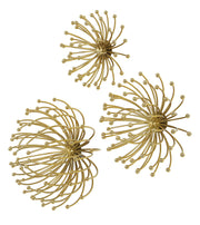 Set of three gold metal wall decor panels by Uttermost featuring modern geometric designs for stylish wall accents.