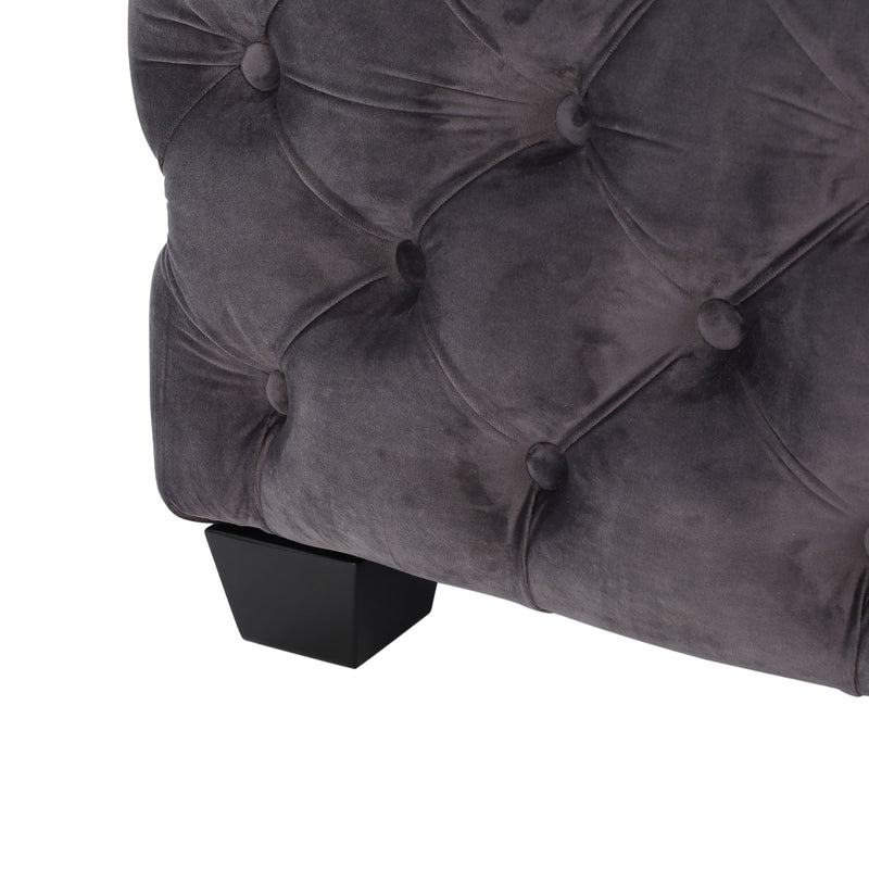 Noble House modern glam upholstered ottoman with button tufted design, plush fabric, and stylish appearance.