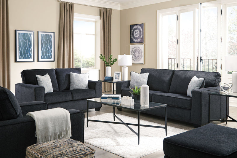 Signature Design by Ashley Altari sleeper sofa with plush fabric, featuring a folded-out bed and modern design in a living room setting.