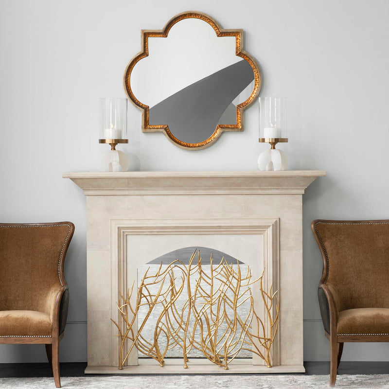 Elegant gold wall mirror by Uttermost featuring a sleek, modern frame with reflective glass for stylish interior decor.