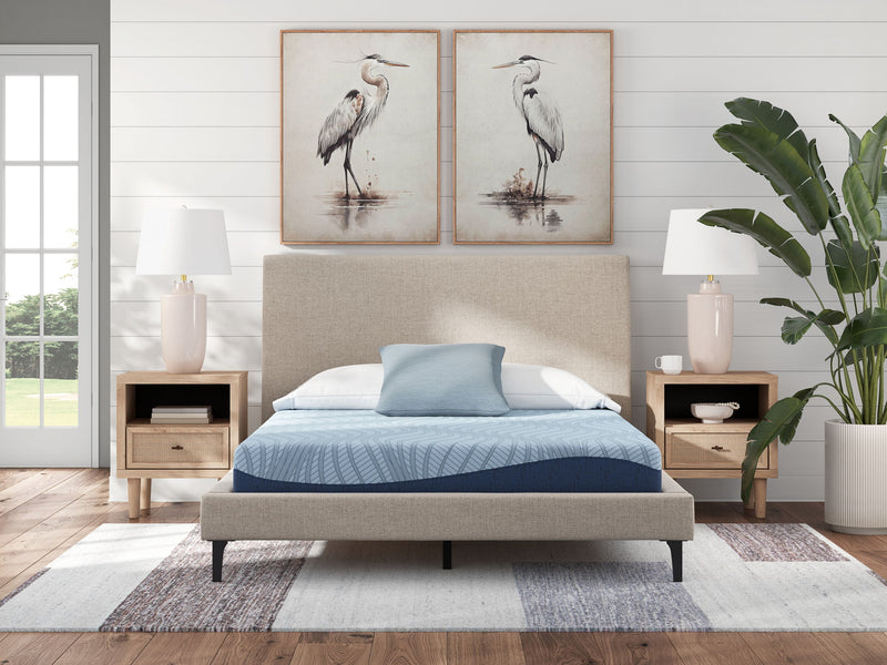 Sierra Sleep® Peak 2.0 8-inch memory foam mattress showing plush top surface and supportive foam layers in a bedroom setting.