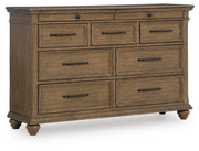 Signature Design by Ashley Karallin dresser with multiple drawers and modern wood finish, ideal for bedroom storage.