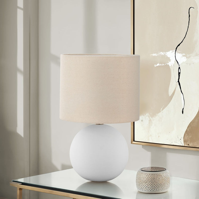 Cream ceramic resin table lamp with contemporary design by 8th Street, featuring a sleek, modern look for stylish lighting.