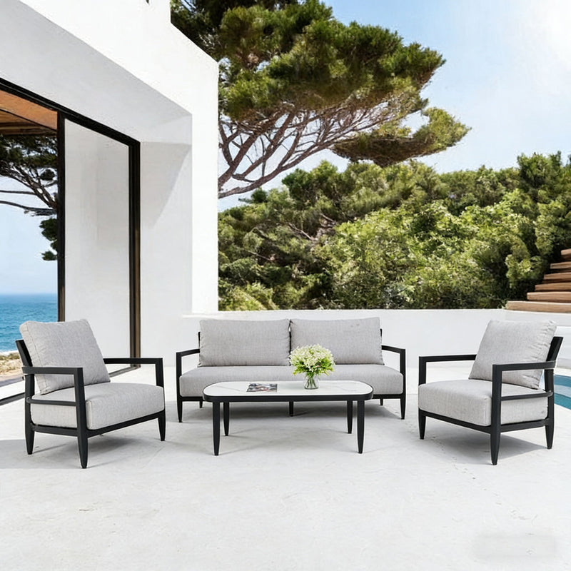 Life Outside 4-piece outdoor conversation set with chairs, bench sofa, tables, and Sunbrella cushions in a backyard setting.
