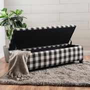 Black Noble House storage ottoman with cushioned seating and hidden interior storage, ideal for living room or bedroom.