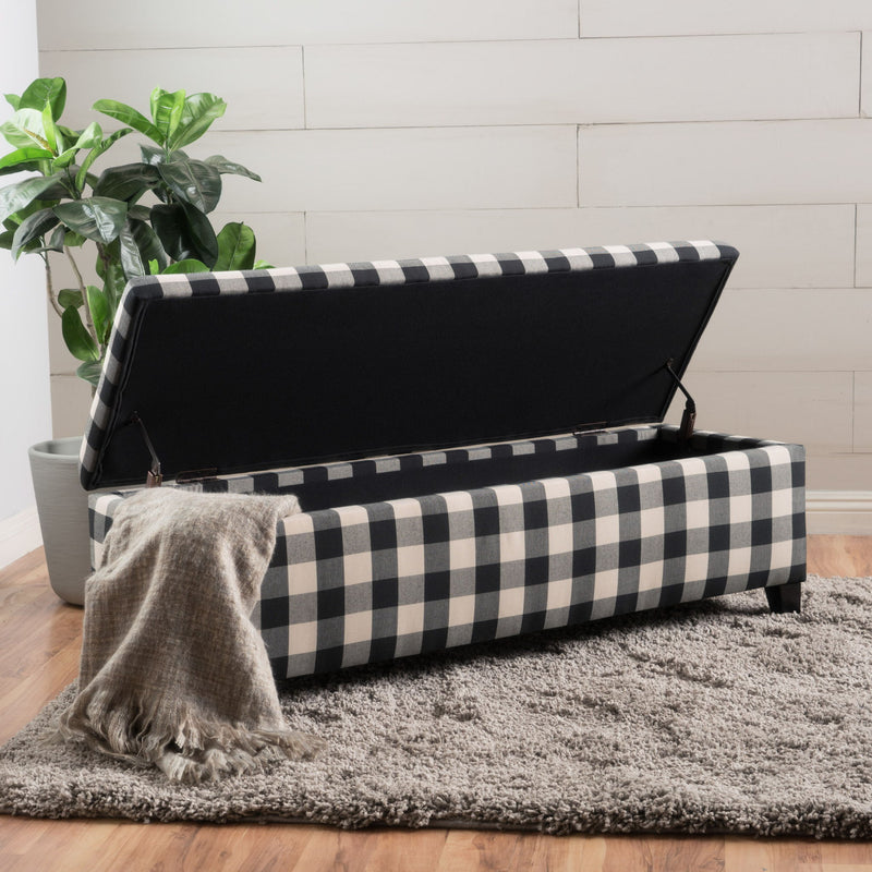 Black Noble House storage ottoman with cushioned seating and hidden interior storage, ideal for living room or bedroom.
