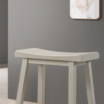 Set of two Lilola Home Alonzo 17.5-inch backless ergonomic counter height stools with wooden legs and footrests.