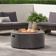 Round Noble House iron fire pit with 40,000 Btu, featuring a sturdy metal design and a spacious top for outdoor fires.