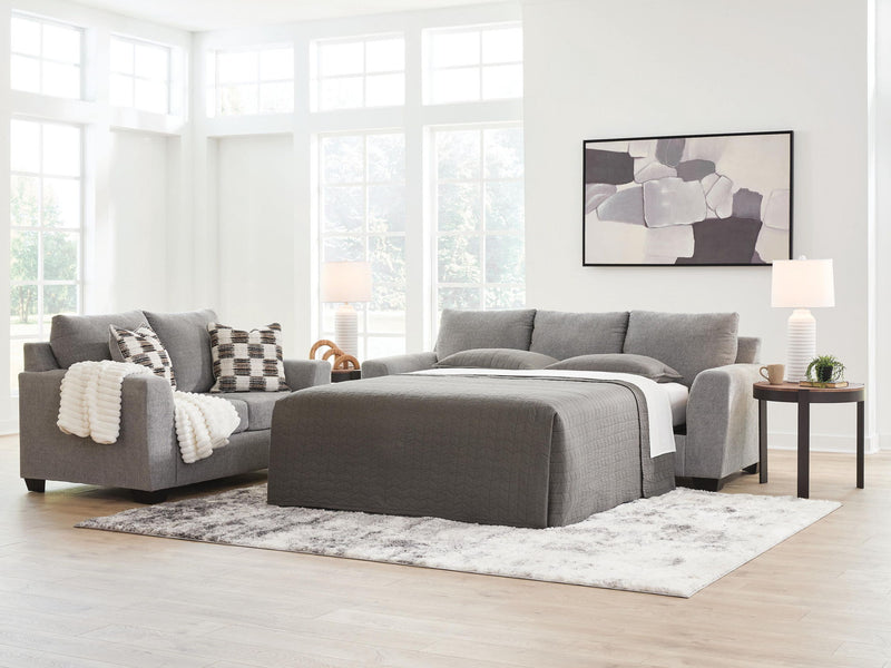 Benchcraft® Loreo sofa sleeper with plush fabric and convertible design, showcasing its seating and sleeping features.