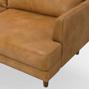 Livingston upholstered stationary sofa by Simpli-Home with plush fabric and cushioned seating in a modern living room setting.