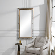 Farrow Copper Industrial Wall Mirror by Uttermost featuring a round gold-finished metal frame.