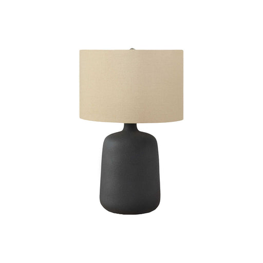 Contemporary black table lamp by 8th Street featuring a sleek modern design with a cylindrical shade and minimalist base.