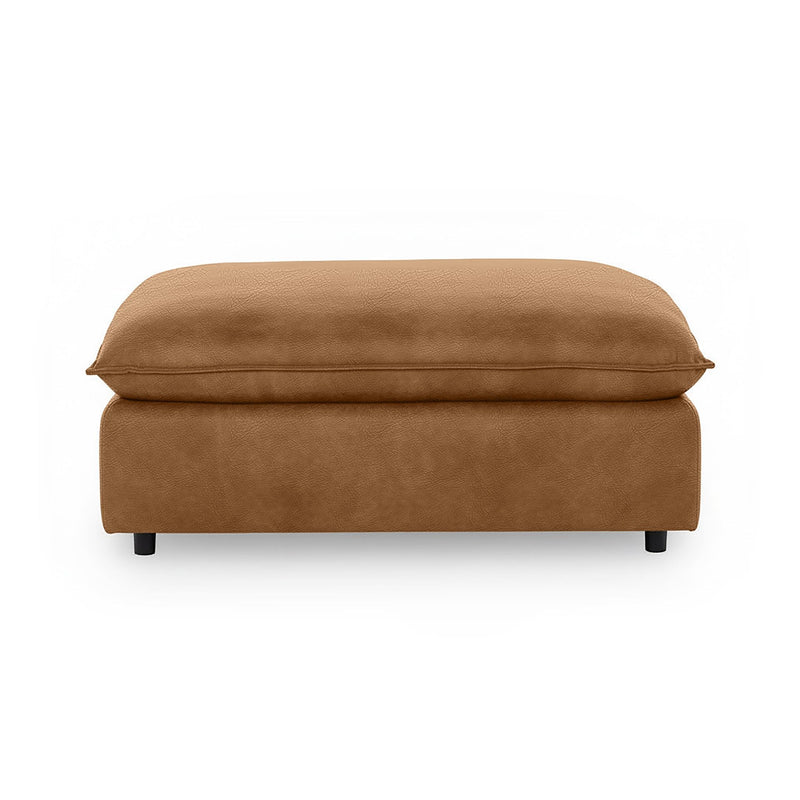 Classic Home Caplan upholstered ottoman with soft fabric, square shape, and cushioned top for versatile living room seating.