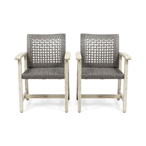 Set of two Noble House outdoor dining chairs with acacia wood frames and slatted seats, ideal for patio or garden seating.