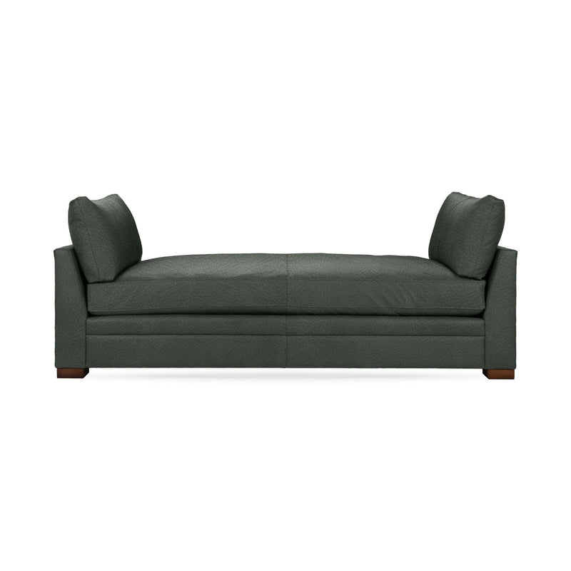 Classic Home Audrey daybed with a wooden frame and plush cushions, showcasing its elegant design and cozy seating.