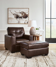 Signature Design by Ashley Santorine living room set with stationary chair and ottoman, featuring plush upholstery and modern style.
