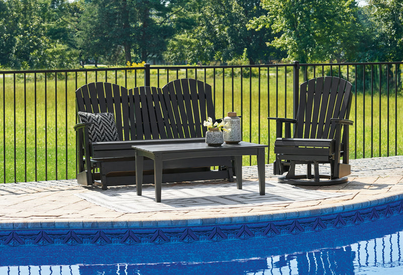 Signature Design by Ashley Hyland Wave 3-piece outdoor set with wicker chairs and glass-top table in a sunny backyard setting.