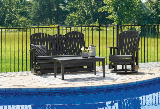 Signature Design by Ashley Hyland Wave 3-piece outdoor set with wicker chairs and glass-top table in a sunny backyard setting.