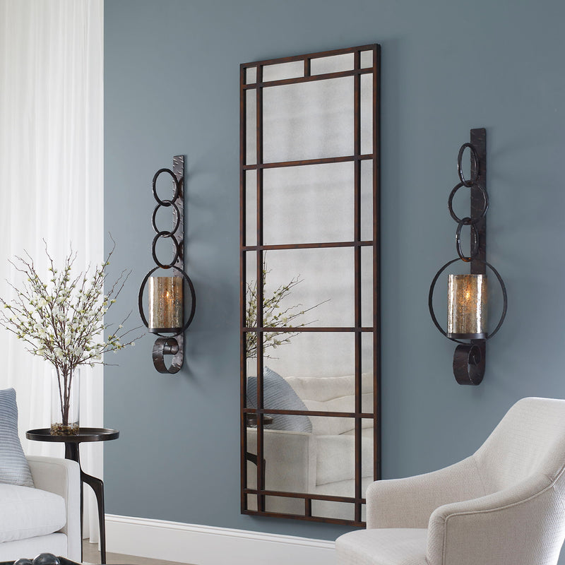 Dark brown metal wall sconce from Uttermost Falconara wall decor featuring a sleek, modern design for stylish wall accent.