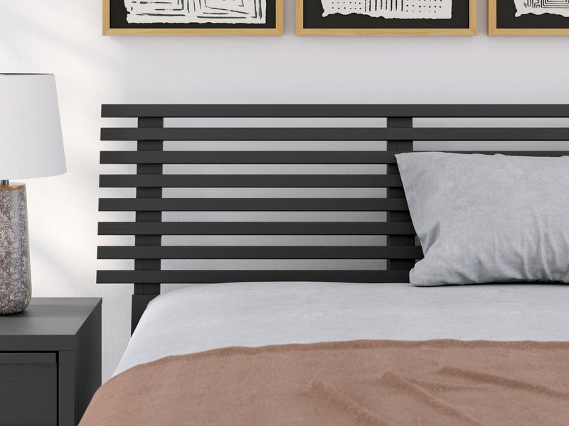 Signature Design by Ashley Danziar slat panel headboard with a modern, stylish wooden design for a queen or king-sized bed.