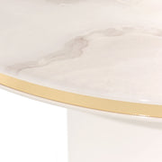 Michael Amini Gineverra round cocktail table with ivory and gold finish, showcasing elegant design and smooth surface.