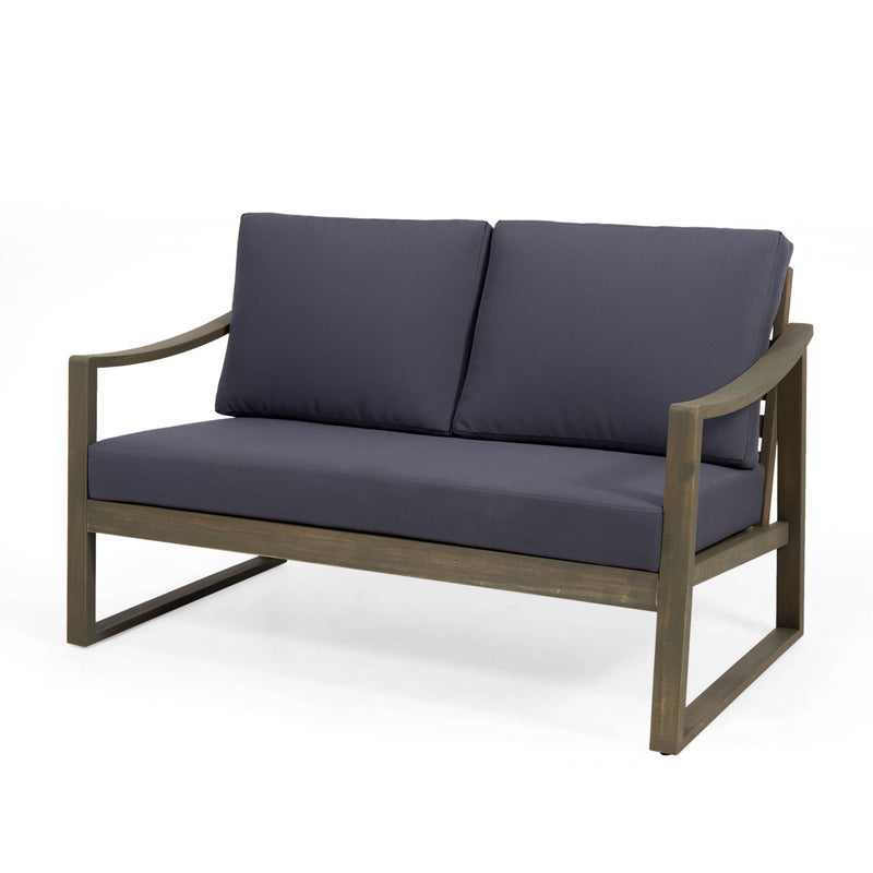 Noble House Samwell outdoor 2-piece coffee table and loveseat set with weather-resistant cushions and modern design.
